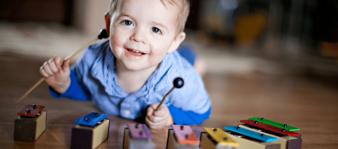 Image of baby playing chimes