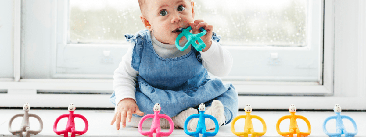 baby with teething toy