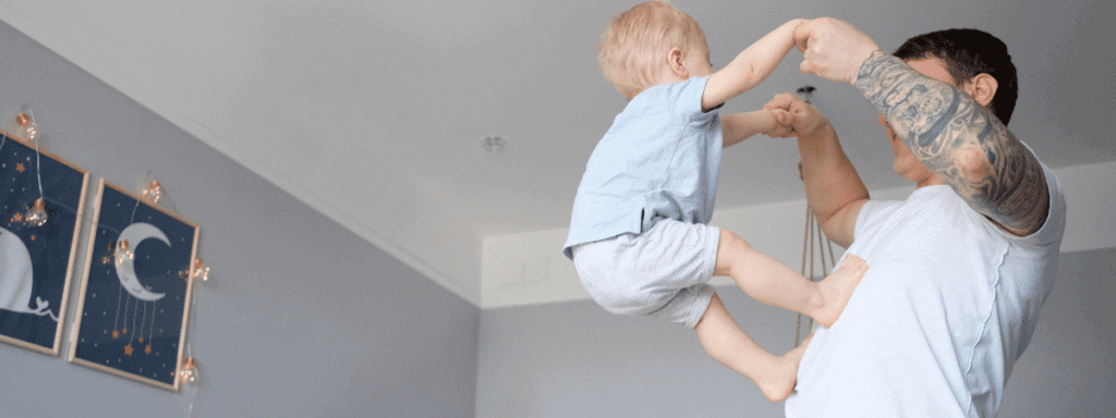 dad playing with baby