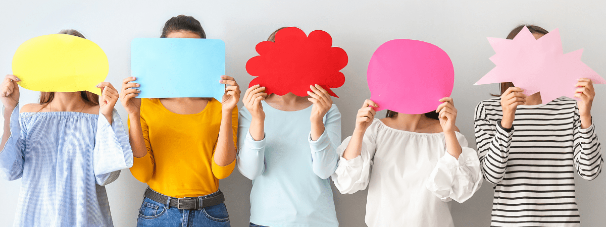 women holding speech bubbles