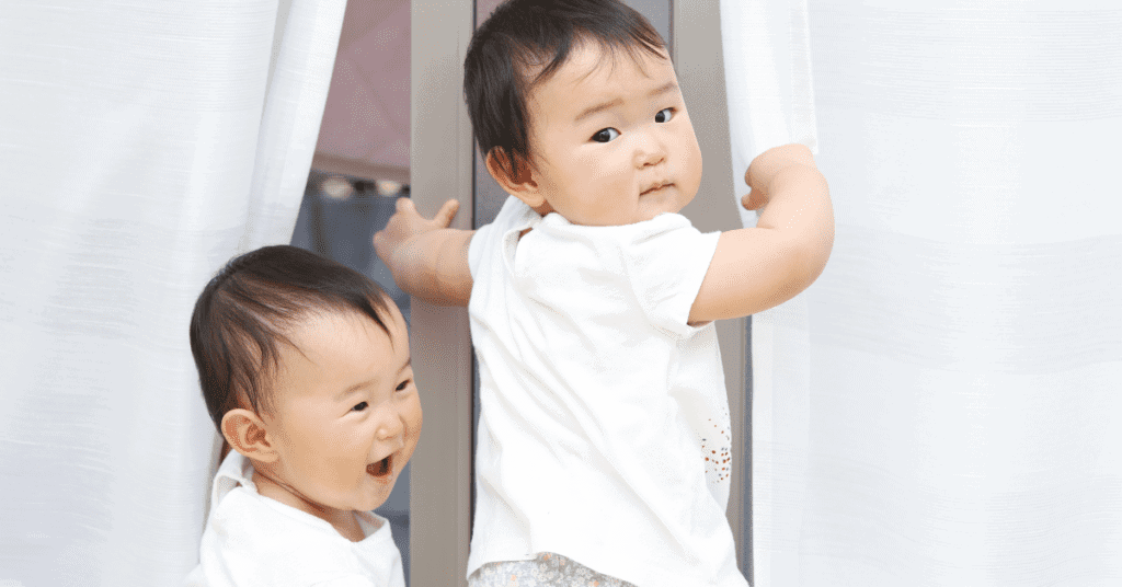 Twins climbing and playing