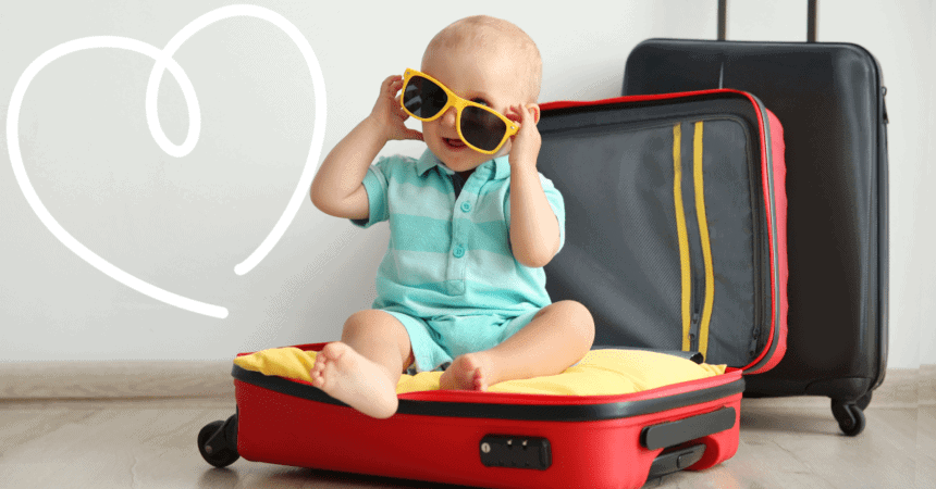 Small child sitting in a suitcase ready to go travelling! 