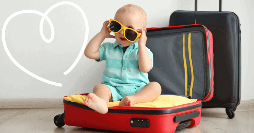 toddler sitting on suitcase