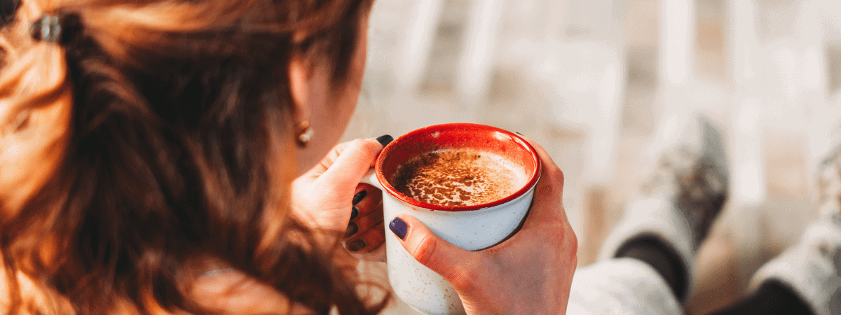 woman enjoying a cup of coffee