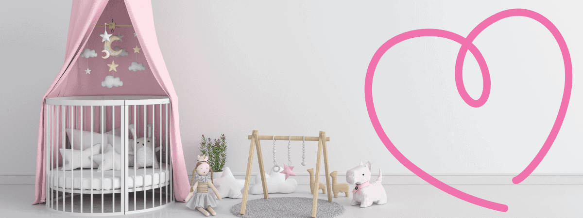 The image shows what looks like a baby's set-up, including a circular crib (with ornamental pillows and a stuffed toy inside) and a few other sensory toys beside it. 