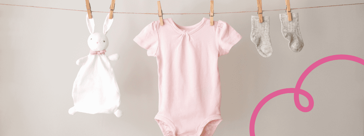 Toddler clothing (a Babygro and socks), and a bunny comfort blanket, are pegged to a washing line. 