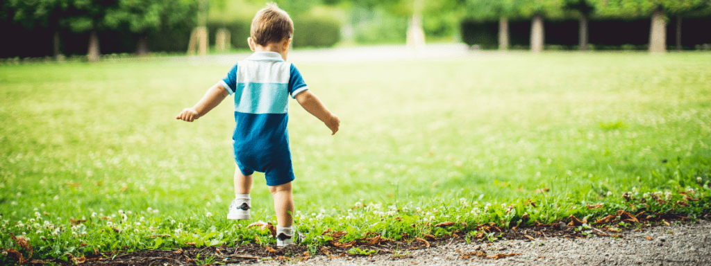 Things to do in Leeds: toddler is excitably running through a park.