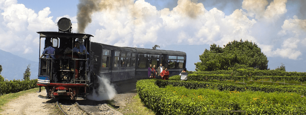 Things to do in Leeds: ride on the Middleton railway. Image shows an old fashioned train on tracks -with tourists taking a photograph in front of it.