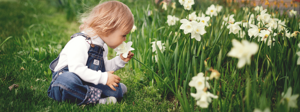 Things to do in Leeds: toddler is excitably running through a park.