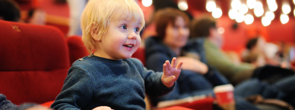 Things to do for families in Cardiff: image shows a toddler sitting in a cinema