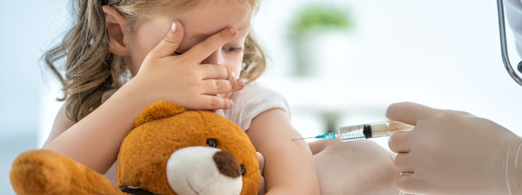 Toddler's Jab- small girl receiving her Measles jab