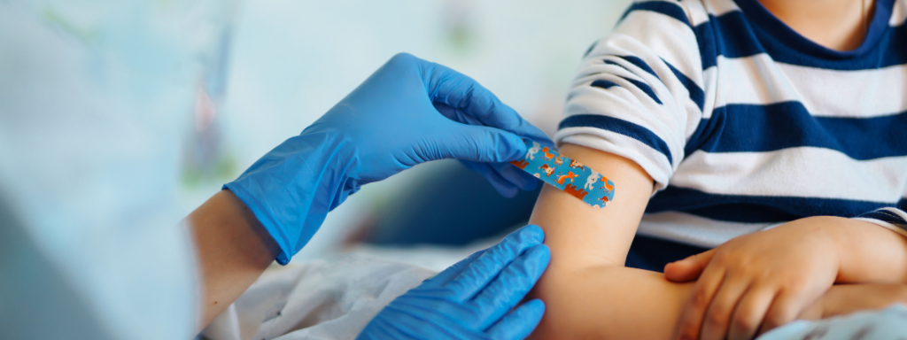 Toddlers jab - receiving a plaster after the vaccination. 