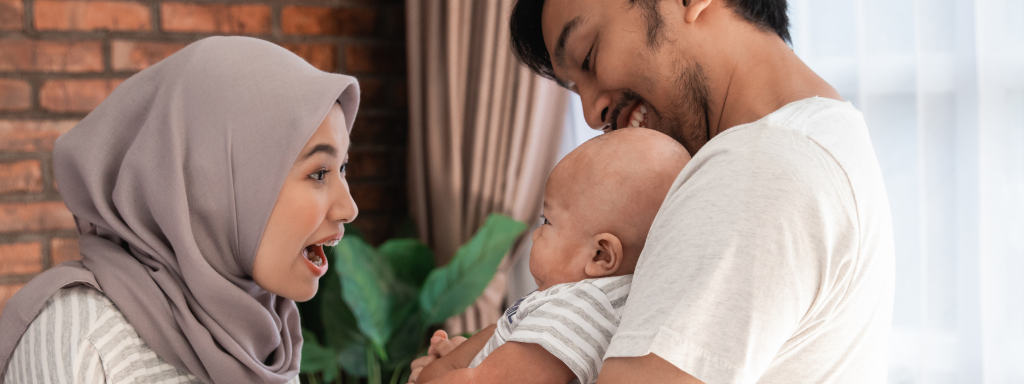 de-stress as a parent - image shows a mother and father playing with their baby