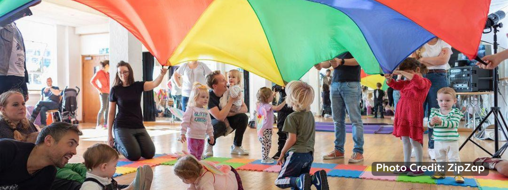 What to expect at your first baby class: image shows parachute games from a ZipZap class
