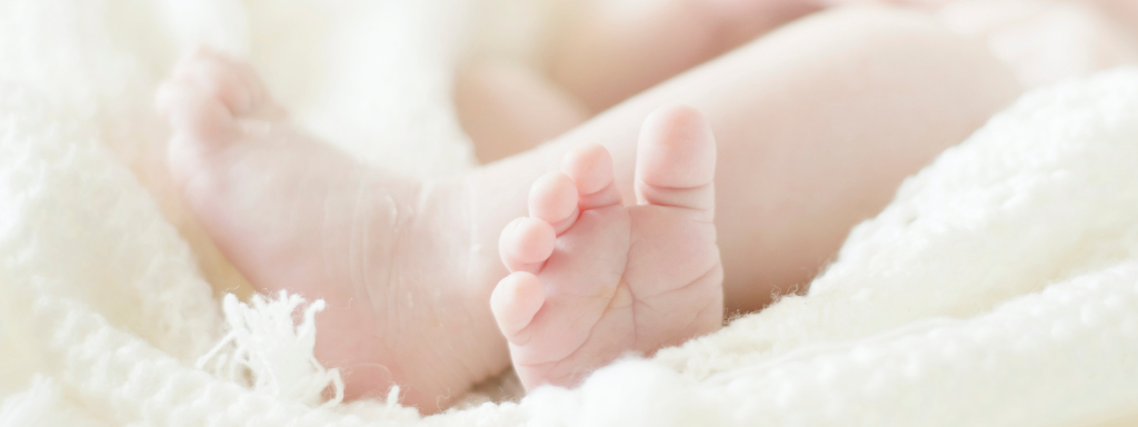 A close up of cute baby toes