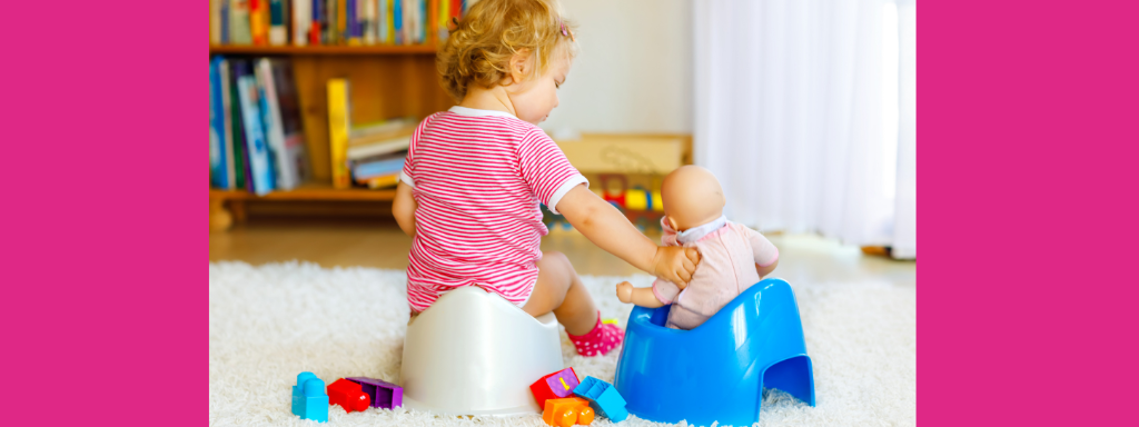 A toddler sits on her potty with her back to the camera, a dolly also sits on a potty next to the toddler